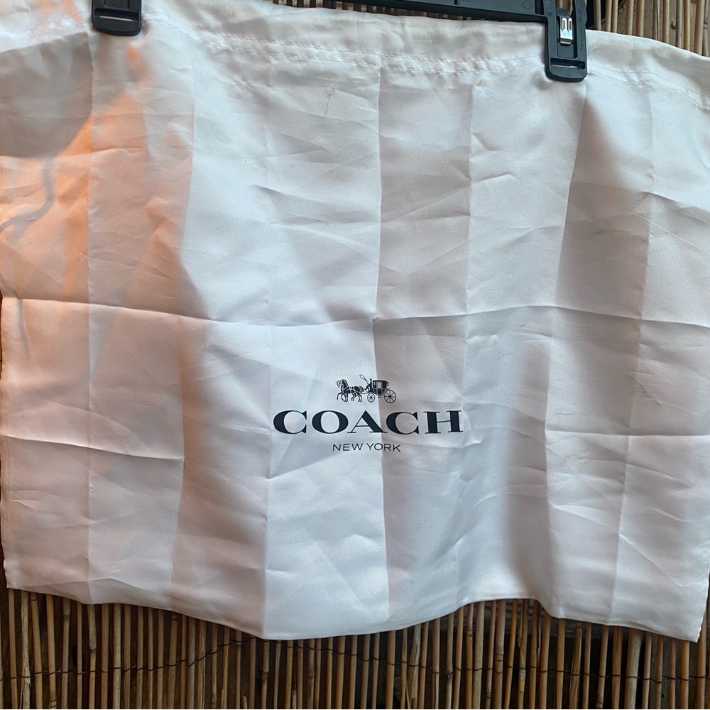Coach White Satin Storage Bag
Measures 23 inches by 18 inches